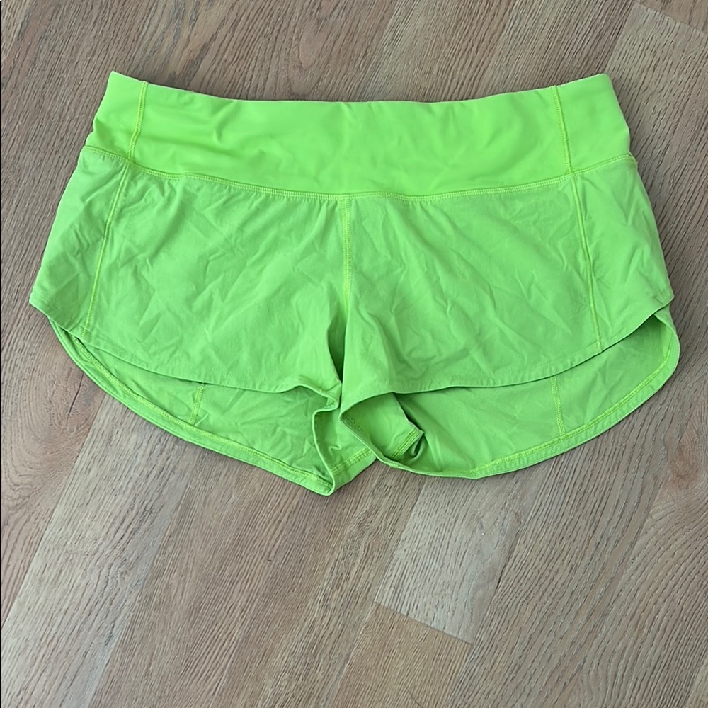 Lululemon Vibrant Green Athletic Running Shorts with Curved Hem
